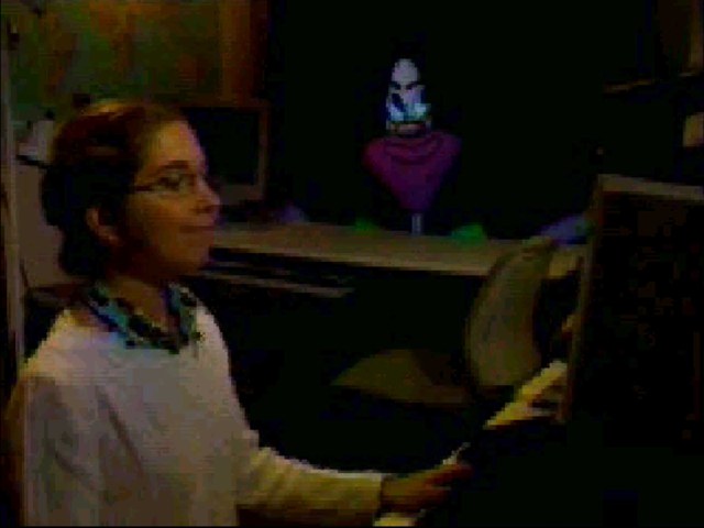 A person using LAFTER while the system tracks the face on a nearby display.