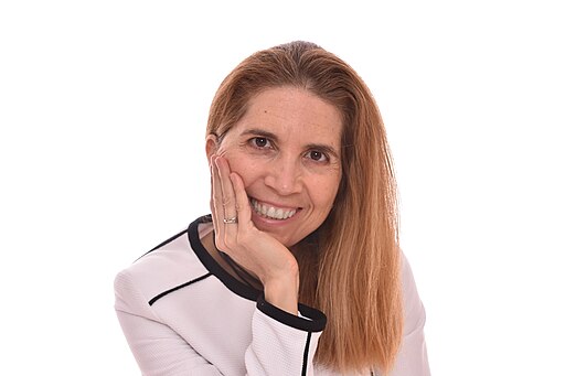 Portrait of Nuria Oliver on a white background