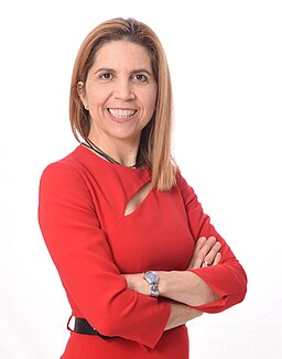 Nuria Oliver wearing red on a white background